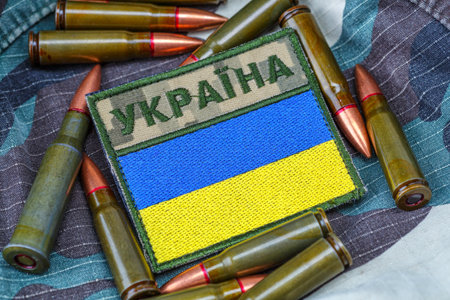 Fabric curved flag of Ukraine, UA. Blue and yellow colors.Ukraine patch on army uniform.Stop war.Patriotism.Concept of Ukraine.Democracy and politics. Close up shot, backgroundの写真素材