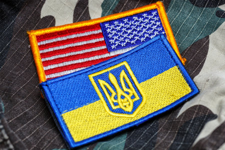 Fabric curved flag of Ukraine, UA. Blue and yellow colors.Ukraine patch on army uniform.Stop...