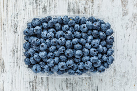Water drops on ripe sweet blueberry. Fresh blueberries background with copy space for your text. Vegan and vegetarian concept. Macro texture of blueberry berries.Texture blueberry berries close upの写真素材