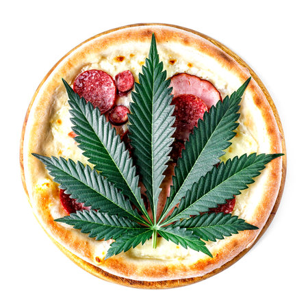 cannabis food with Pizza on wooden tray top view delicious tasty fast food italian traditional pizza cheese with Mozzarella.Cannabis is a standoff between a drug and a medicine.の写真素材