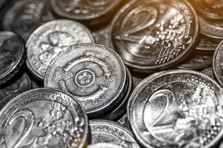 United kingdom Pound coin.British coins stack on black, pound sterling,Business concept.Numismatics. Iron money.Collectionの写真素材