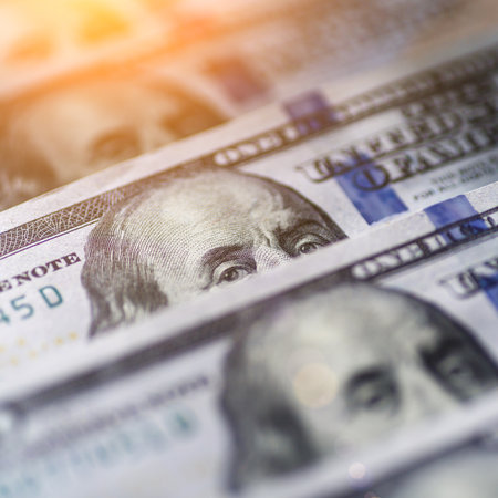 Money american hundred dollar bills.Closeup of assorted American banknotes.US currency scattered on the table.america currency dollor currency.World economic crisis associated with coronovirus.の写真素材
