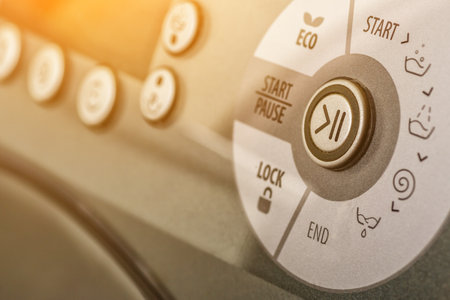 Washing machine.Modern washing machine front panel with display.Knob for selecting the modes of washing on the washing machine.Washing clothes. Banner for website or print with copy spaceの写真素材