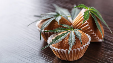 Cupcake with marijuana.traditional sponge cake with cannabis weed cbd. Medical marijuana drugs in food dessert, ganja legalization.の写真素材