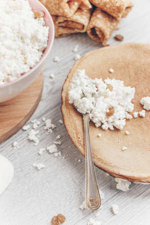 Pancakes with cottage cheese filling.