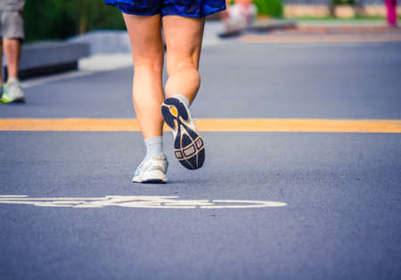 Jogging in the park in the morningの写真素材