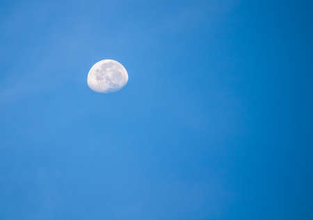 Big moon at daybreak time in Shenzhen with blue skyの写真素材