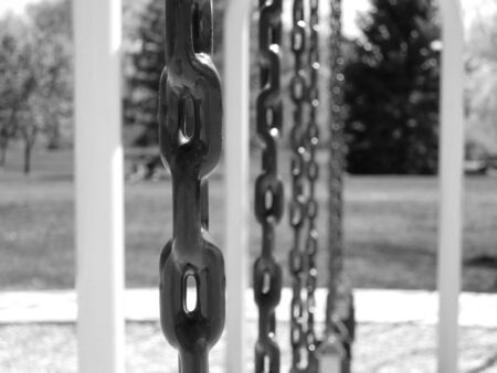 Close-up of a chain on a swing-set at a park