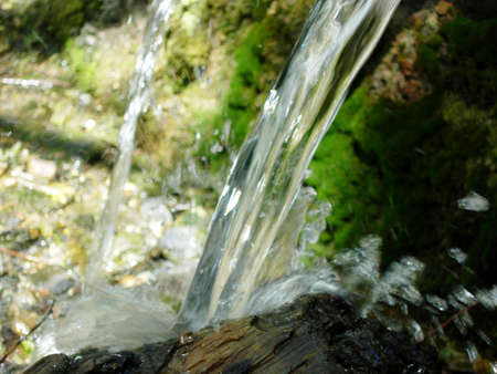 Water splashing on a piece of wood