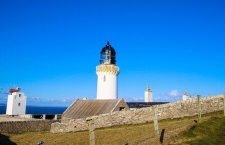 Lighthouse with houseの写真素材