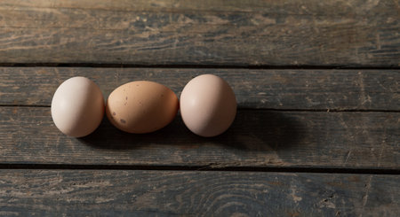 Chicken egg on a wooden background. Concept: market, eggs, foodの写真素材