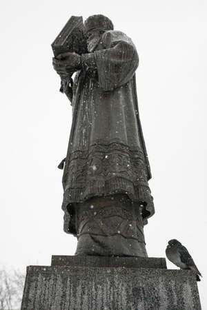 Dove on the monument in the snow. Concept: weather, travel, architectureの写真素材