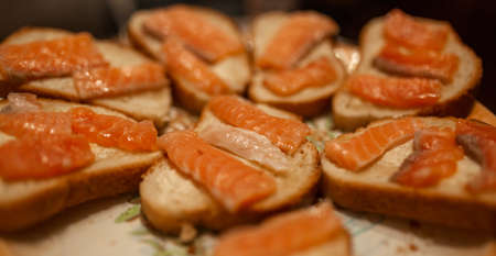 holiday appetizer. Sandwiches with red fish. Sturgeon, sterlet, trout, salmon, pink salmonの写真素材