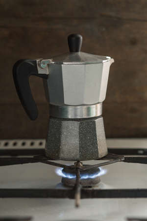 Turk coffee maker stands on a gas stove. visible fireの写真素材