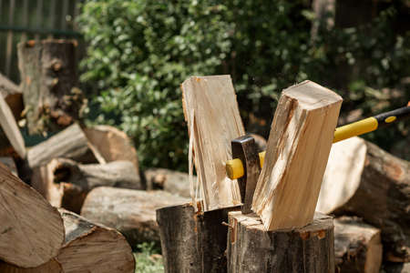 The ax cuts the log for firewood. Chopped glades