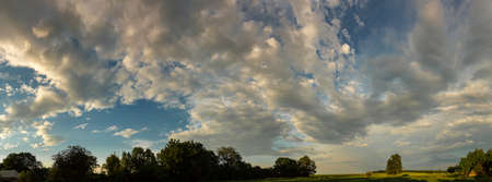 Beautiful sunset rural landscape. Vegetable garden, agriculture, incredible skyの写真素材