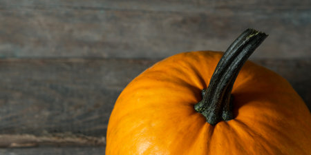 Top view pumpkin on wooden texture backgroundの写真素材