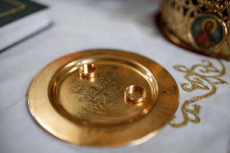 wedding rings on a gold plate