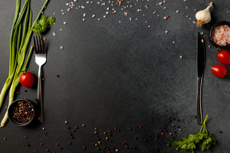 Cooking background On black wooden background. View from above. Free space for text.