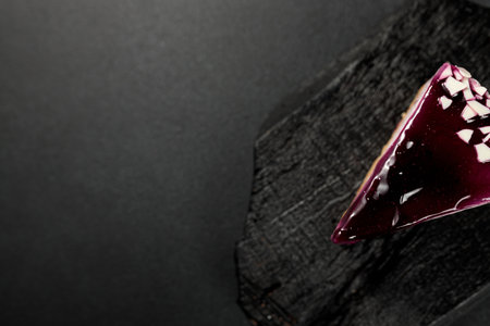 Sumptuous blueberry cheesecake on a captivating black background. A tempting delight for dessert...