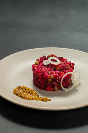 Classic Russian Beet Salad with Mustard Seeds on Plate. Vinaigretteの写真素材