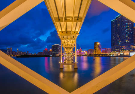 Twilight cityscape of bridge and skyscraper Macaoの写真素材