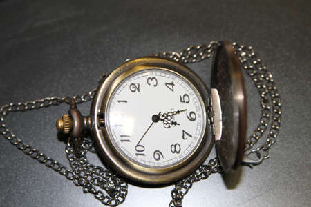 Handheld clock in officeの写真素材