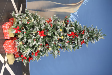 A Christmas tree standing in a shopping mallの写真素材
