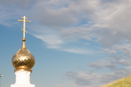 Gold dome of orthodox church with a crossの写真素材