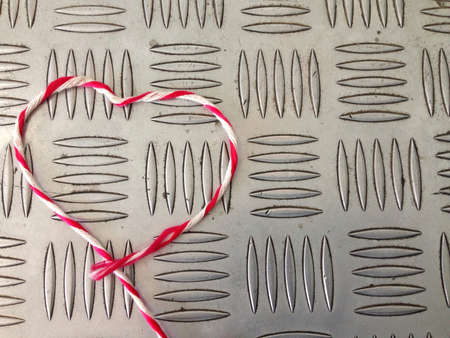 Heart shape from rope and grunge backgroundの素材