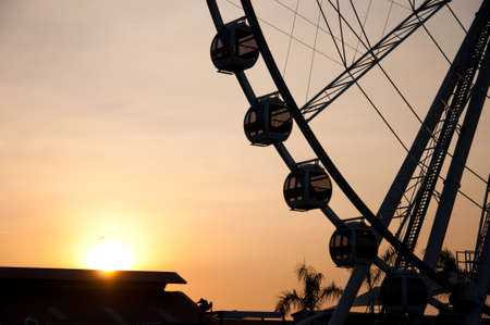 Silhouette of giant ferris wheel の写真素材