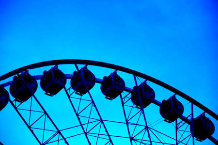 Silhouette of giant ferris wheel の写真素材