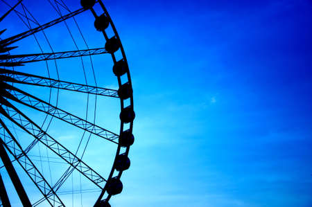 Silhouette of giant ferris wheel 