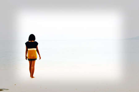 Girl alone on the beachの素材