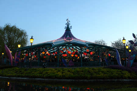 Paris, France, 9 April 2011: Mad Hatter's Tea Cups at night in Disneyland Parisのeditorial素材