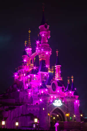 Paris, France, 18 February 2012 - Disneyland Paris Castle illuminated at night during the 20th anniversary. Disneyland Paris is a holiday and recreation resort in Paris. It is the most visited themed attraction of Europe.のeditorial素材