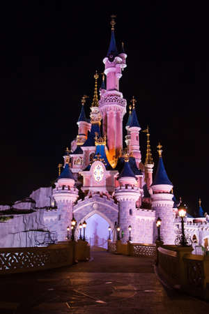 Paris, France, 2 August 2012 - Disneyland Paris Castle illuminated at night. Disneyland Paris is an holiday and recreation resort in the eastern suburbs of Paris, France.のeditorial素材