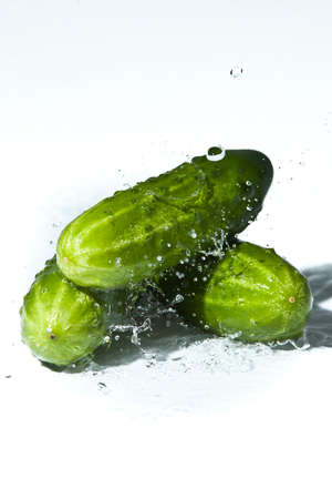 cucumber in spray of water. Juicy cucumber with splash on backgroundの写真素材