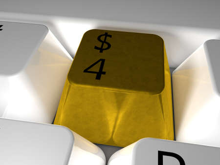 Gold button   on white keyboardの写真素材
