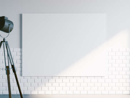 Mockup of blank white canvas in loft industrial light. Minimalistic interior.の写真素材