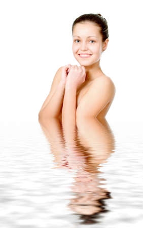 Perfect female torso. On a white background with reflection in waterの写真素材