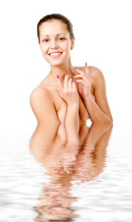 Perfect female torso. On a white background with reflection in waterの写真素材