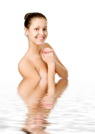 Perfect female torso. On a white background with reflection in waterの写真素材