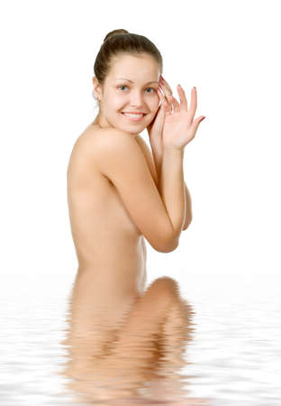 Perfect female torso. On a white background with reflection in waterの写真素材