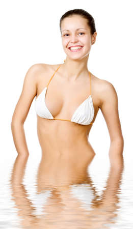 Beautiful young woman reflected in waterの写真素材