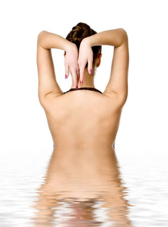 Beautiful young woman reflected in waterの写真素材