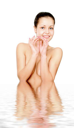 Perfect female torso. On a white background with reflection in waterの写真素材