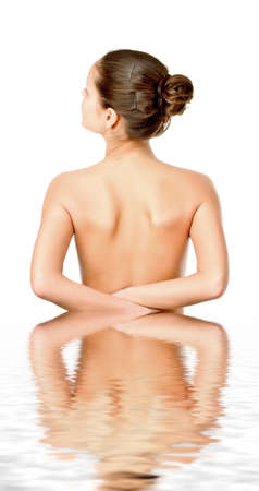 Perfect female torso. On a white background with reflection in waterの写真素材