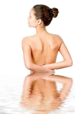 Perfect female torso. On a white background with reflection in waterの写真素材