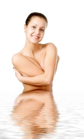 Perfect female torso. On a white background with reflection in waterの写真素材